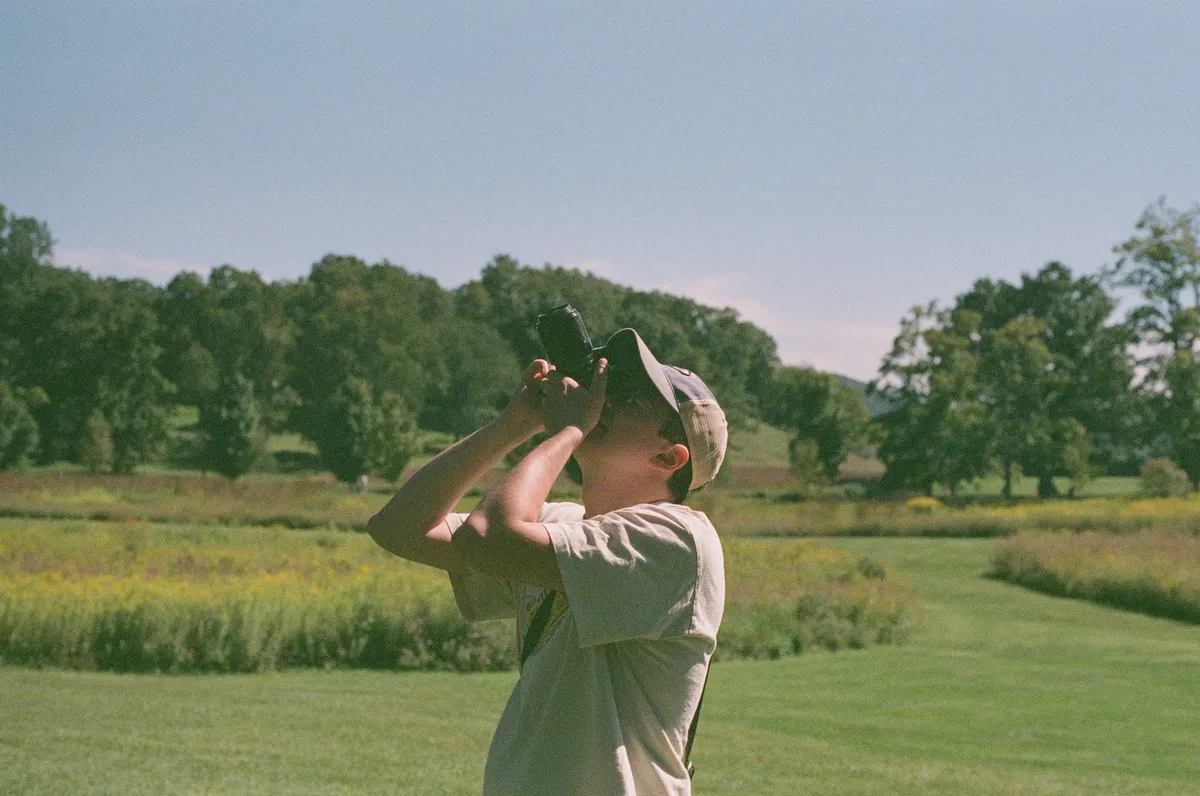 Alexei photographing a field at golden hour